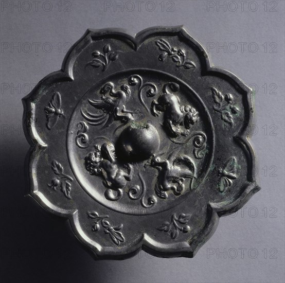 Octafoil Mirror with Paired Phoenixes and Animals, late 7th-early 8th century. China, Tang dynasty (618-907). Bronze; diameter: 12.3 cm (4 13/16 in.); overall: 1 cm (3/8 in.); rim: 0.8 cm (5/16 in.).