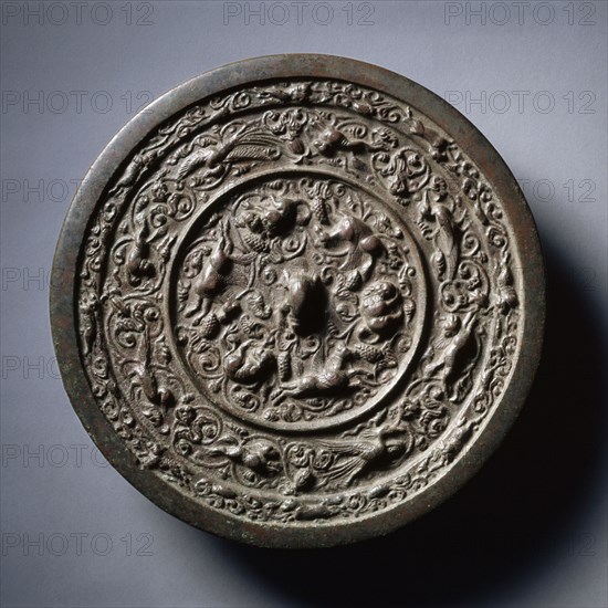 Mirror with Auspicious Animals, Celestial Horses, and Grapevines, early 1100s-mid-1200s. China, Jin dynasty (1115-1234). Bronze; diameter: 25.9 cm (10 3/16 in.); overall: 0.8 cm (5/16 in.); rim: 0.9 cm (3/8 in.).