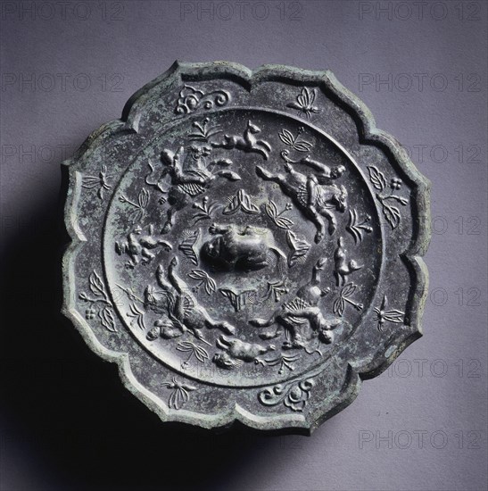 Octafoil Mirror with Hunters and Prey, late 7th-early 8th century. China, Tang dynasty (618-907). Bronze; diameter: 20 cm (7 7/8 in.).
