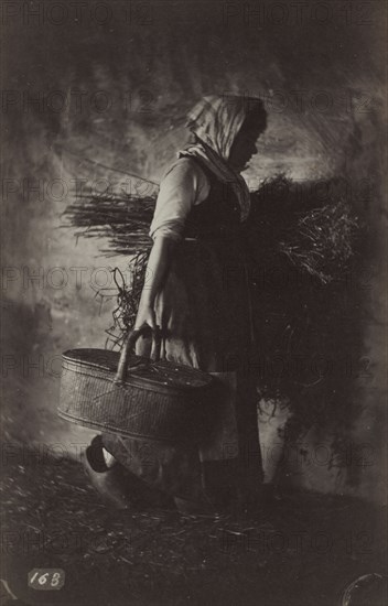 Female Peasant Carrying a Basket and Hay, c. 1870. Auguste Giraudon (French). Albumen print from wet collodion negative; image: 17.2 x 11.1 cm (6 3/4 x 4 3/8 in.); mounted: 20.7 x 15.8 cm (8 1/8 x 6 1/4 in.); matted: 45.7 x 35.6 cm (18 x 14 in.)