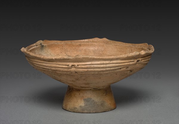 Pedestalled Dish, c. 1000 - 500 BC. Japan, late Jomon era. Burnished earthenware with carved and impressed decoration; overall: 9.5 x 19 x 5.1 cm (3 3/4 x 7 1/2 x 2 in.); pedestal: 3.5 x 3.5 cm (1 3/8 x 1 3/8 in.).
