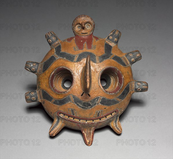 Oculate Being Mask, 300 BC-AD 1. Peru, South Coast, Paracas (Cavernas) style (700 BC-AD1), 300 B.C. to A.D. 1. Ceramic, resin-based paint; overall: 23.6 x 22.5 x 13.2 cm (9 5/16 x 8 7/8 x 5 3/16 in.).