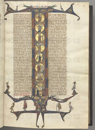 Fol. 1r, Genesis, with a full-length historiated initial I, showing the Creation and the Crucifixion, all on burnished gold grounds, with diapered pink and blue frames and cusped dragon and foliage extensions at top and bottom, on which are perched a vari, c. 1275-1300. Southern France, Toulouse(?), 13th century. Bound illuminated manuscript in Latin; brown morocco binding; ink, tempera and gold on vellum; 533 leaves