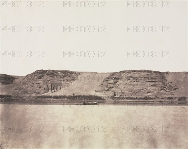 General View of Monuments Carved into Bedrock with Photographer's Dahabieh. Abu Simbel, 1851-1852. Félix Teynard (French, 1817-1892). Salted paper print from a paper negative; image: 24.8 x 30.9 cm (9 3/4 x 12 3/16 in.); paper: 26.7 x 35.5 cm (10 1/2 x 14 in.); matted: 50.8 x 61 cm (20 x 24 in.)