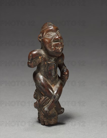 Male Figurine or Finial, early 1800s-early 1900s. Central Africa, Democratic Republic of the Congo (most likely), Cabinda, or Republic of the Congo, probably Yombe. Wood; overall: 9.7 x 3.8 x 3.3 cm (3 13/16 x 1 1/2 x 1 5/16 in.)