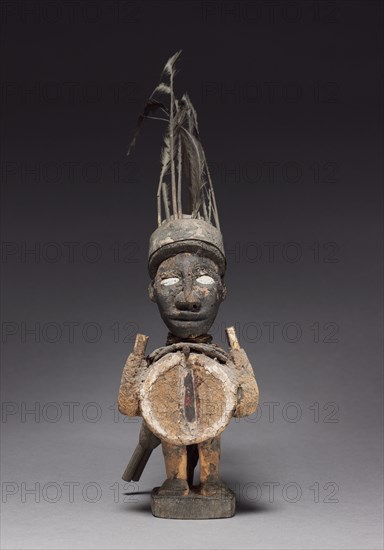 Figurine, late 1800s-early 1900s. Central Africa, Republic of the Congo, Kongo people. Wood and various other materials; overall: 34 x 9.5 x 25 cm (13 3/8 x 3 3/4 x 9 13/16 in.)