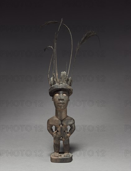 Figurine, late 1800s-early 1900s. Central Africa, Republic of the Congo, Kongo people. Wood and various other materials; overall: 29.5 x 12 x 16 cm (11 5/8 x 4 3/4 x 6 5/16 in.)