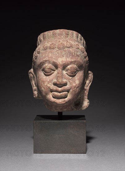 Head of Kubera, 200s. Northern India, Mathura, Kushan period (c. 80-320). Spotted red sandstone; overall: 16 x 14 x 14 cm (6 5/16 x 5 1/2 x 5 1/2 in.); block: 24.5 x 10.2 x 8.3 cm (9 5/8 x 4 x 3 1/4 in.).