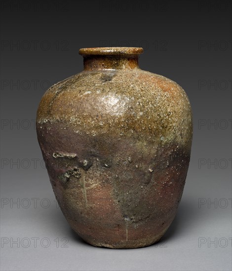 Storage Jar, 1500s. Japan, Muromachi period (1392-1573). Stoneware with natural ash glaze (Shigaraki ware); diameter: 28.3 cm (11 1/8 in.); overall: 34 cm (13 3/8 in.).