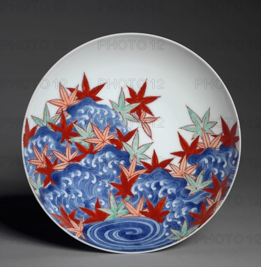 Dish with Maple Leaves in Waves, c. 1688-1716. Japan, Edo period (1615–1868), Genroku/Shotoku eras (1688-1716). Porcelain with underglaze blue and overglaze color enamel (Hizen ware, Nabeshima type); diameter: 19.7 cm (7 3/4 in.).