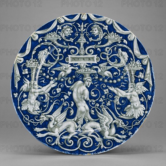 A Candelieri Plate, Piatto, Venice, Veneto, Italy; about 1540 - 1560; Tin-glazed earthenware; 5.7 x 47.6 cm, 2 1,4 x 18 3,4 in