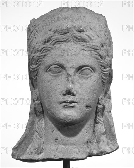 Head from a Statue of a Woman; Cyprus; late 4th century B.C; Limestone; 36.2 × 19.1 × 21 cm, 14 1,4 × 7 1,2 × 8 1,4 in