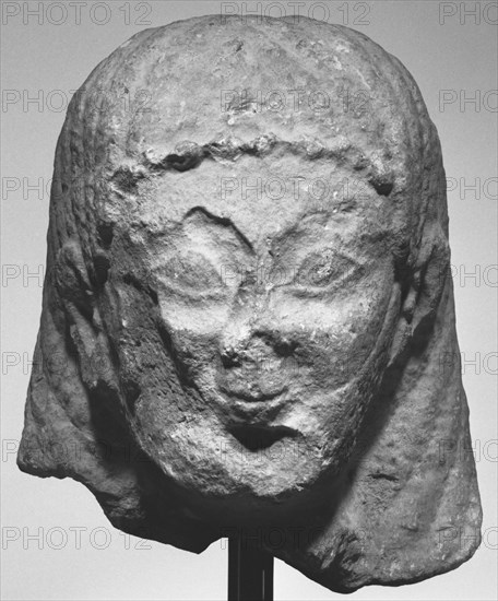 Head from a Statue of a Male Figure; about 540 B.C; Limestone; 29.8 × 20 × 21 cm, 11 3,4 × 7 7,8 × 8 1,4 in