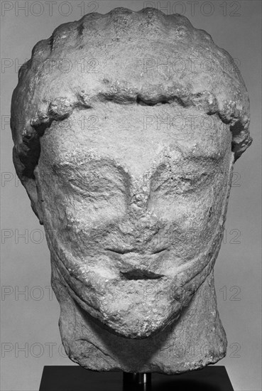 Head from a Statue of a Male Figure; about 500 B.C; Limestone; 29.5 × 19.5 × 14 cm, 11 5,8 × 7 11,16 × 5 1,2 in