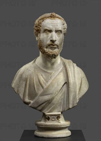 Portrait Bust of a Man, Perhaps a Priest of Serapis; Roman Empire; 180 - 220; Marble with polychromy and gilding; 79.5 × 49 × 27