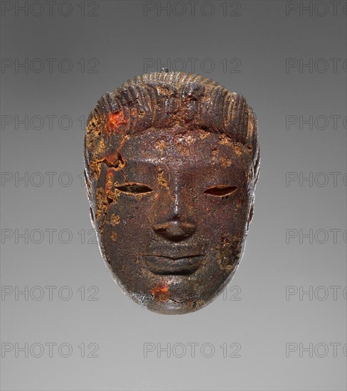 Pendant: Head of a Female Divinity or Sphinx; Tarentum, ?, Italy; 550 - 520 B.C; Amber; 34.5 × 24 × 16 mm
