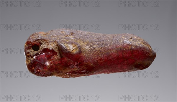 Pendant: Bovine Head; Italy; 500 - 400 B.C; Amber; 35 × 24 × 13 mm, 1 3,8 × 15,16 × 1,2 in