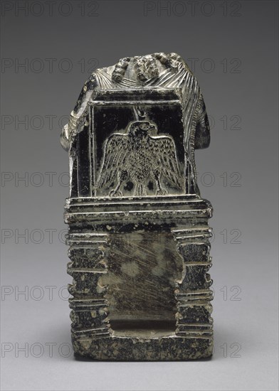 Statuette of Seated Isis with Infant Harpokrates; Egypt; 1st century B.C.–1st century A.D; Steatite; 18 × 8.5 cm