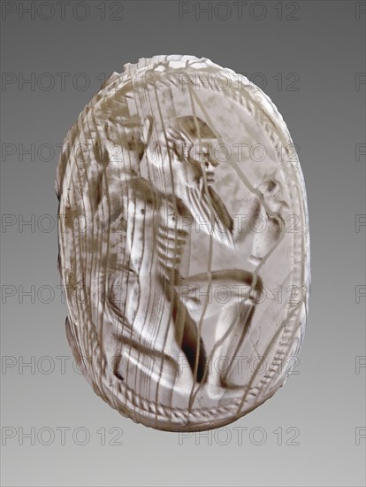 Engraved Scarab with Kneeling Satyr; Master of the London Satyr; about 530 B.C; Blue-grey chalcedony; 1.2 × 2 × 1.4 cm