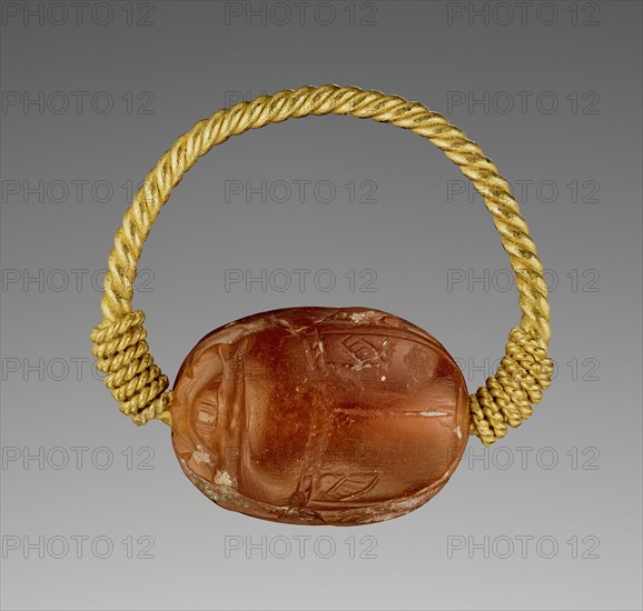 Gem Engraved with a Two-Horse Chariot and Driver; Etruria; 400–300 B.C; Carnelian and gold; 0.8 × 1.5 × 1.2 cm