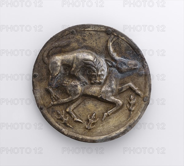 Phalera with Relief of Lion Attacking a Stag; Parthia; 2nd century B.C; Silver with gilding; 9 × 12.6 cm, 3 9,16 × 4 15,16 in