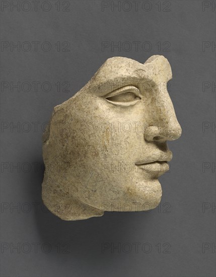 Fragment of a Head; Tarentum, Taras, South Italy; 440 - 430 B.C; Terracotta with clay slip; 14.2 × 14 cm, 5 9,16 × 5 1,2 in