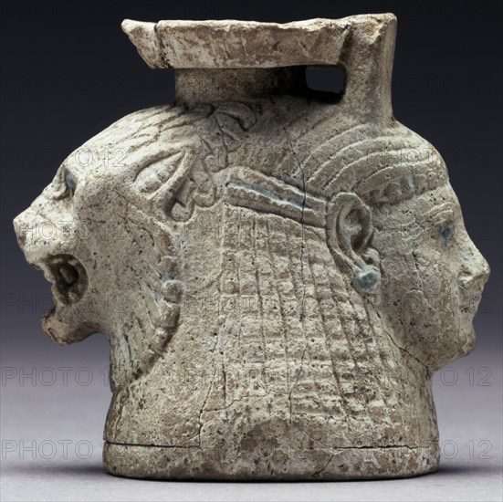Oil Container with the Heads of a Lion and a Woman; Rhodes, Greece; mid-6th century B.C; Faience; 5.6 × 6 × 4 cm