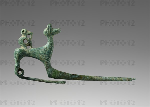Pin Shaped as a Dog with a Monkey; Etruria; 700–650 B.C; Bronze; 3.8 × 7.6 × 2 cm, 1 1,2 × 3 × 13,16 in