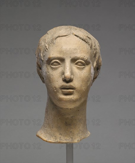 Head of a Youth; Tarentum, Taras, South Italy; 300 - 100 B.C; Terracotta with clay slip; 17.4 × 9.2 × 11.5 cm