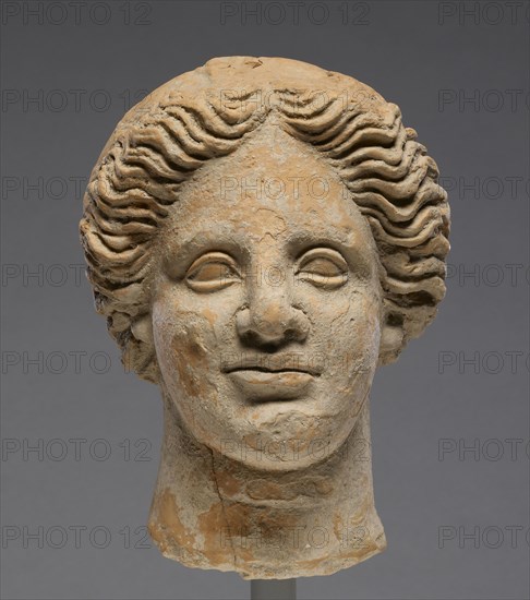 Head of a Woman; Orpheus Master; Tarentum, Taras, South Italy; 350 - 300 B.C; Terracotta with clay slip; 16.5 × 12.6 cm