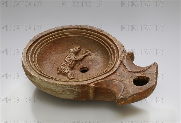 Lamp, North Africa; 1st - 4th century; Terracotta; 2.3 x 7.3 x 10.2 cm, 7,8 x 2 7,8 x 4 in