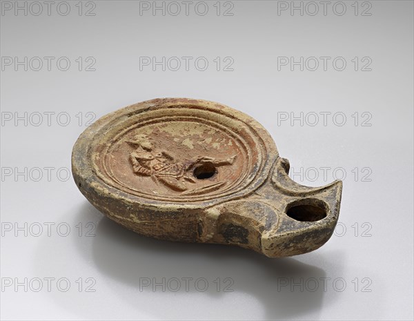 Lamp, Roman Empire; 1st century B.C. - 4th century A.D; Terracotta; 2.1 x 6.3 x 9.1 cm, 13,16 x 2 1,2 x 3 9,16 in
