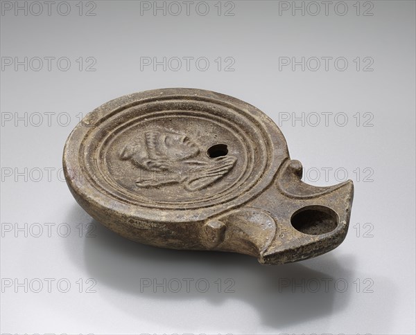 Lamp, Roman Empire; 1st century B.C. - 4th century A.D; Terracotta; 2.4 x 7.8 x 10.8 cm, 15,16 x 3 1,16 x 4 1,4 in