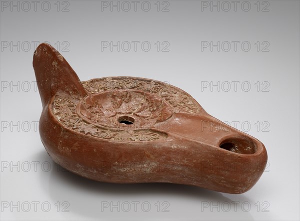 Lamp, North Africa; 1st - 4th century; Terracotta; 3.4 x 8.7 x 14.5 cm, 1 5,16 x 3 7,16 x 5 11,16 in