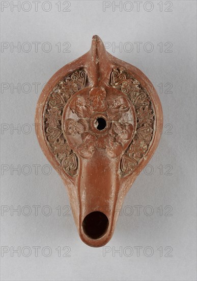 Lamp, North Africa; 1st - 4th century; Terracotta; 3.4 x 8.7 x 14.5 cm, 1 5,16 x 3 7,16 x 5 11,16 in