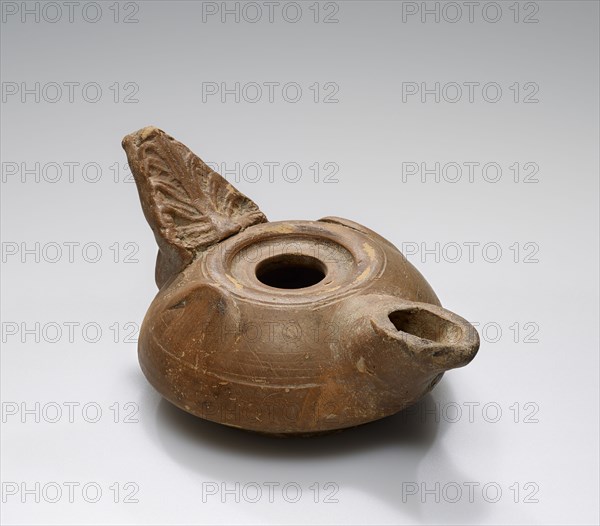 Lamp, Roman Empire; 1st century B.C. - 4th century A.D; Terracotta; 12.1 x 6 x 8.2 cm, 4 3,4 x 2 3,8 x 3 1,4 in