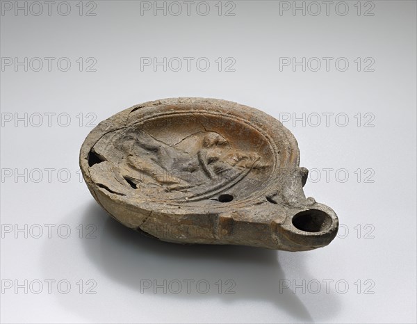 Lamp, Roman Empire; 1st century B.C. - 4th century A.D; Terracotta; 10.5 x 2.4 x 7.6 cm, 4 1,8 x 15,16 x 3 in