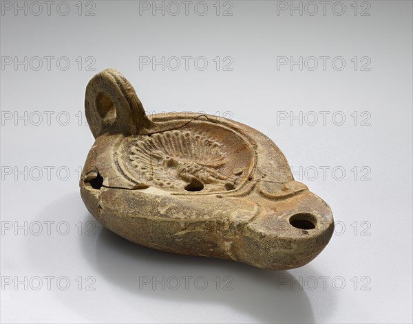 Lamp, Roman Empire; 1st century B.C. - 4th century A.D; Terracotta; 11.2 x 4.4 x 6.8 cm, 4 7,16 x 1 3,4 x 2 11,16 in
