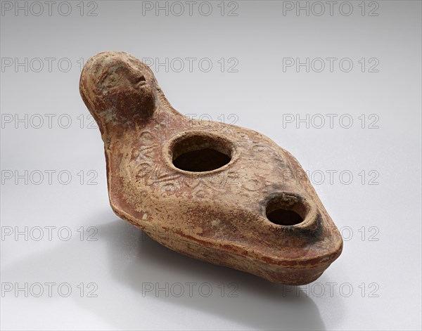 Lamp, Roman Empire; 1st century B.C. - 4th century A.D; Terracotta; 11.1 x 4.9 x 6.4 cm, 4 3,8 x 1 15,16 x 2 1,2 in