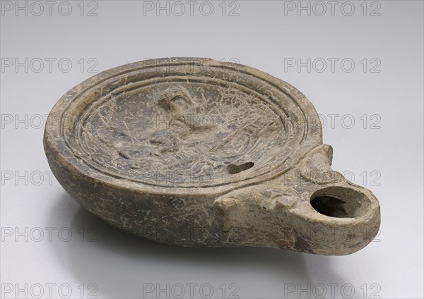 Lamp, Roman Empire; 1st century B.C. - 4th century A.D; Terracotta; 10.5 x 2.6 x 7.6 cm, 4 1,8 x 1 x 3 in