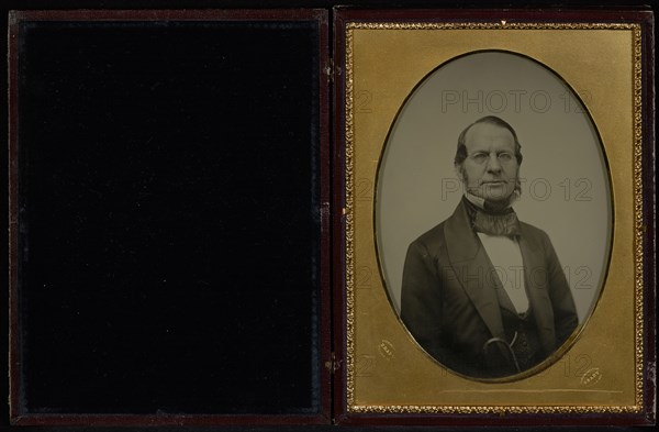 Portrait of an  middle-aged man with muttonchop whiskers, wearing wire-rimmed glasses; Mathew B. Brady American, about 1823