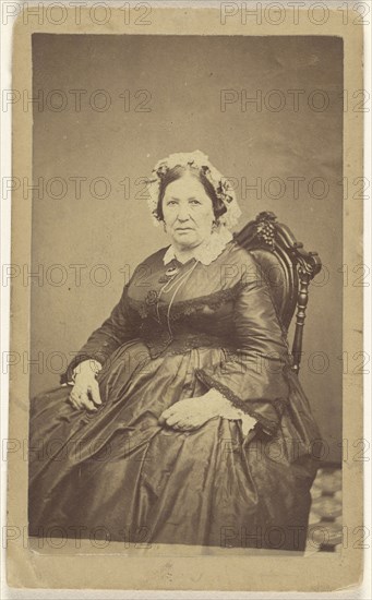 woman with bonnet, seated; Fernando Dessaur, American, active 1880s, 1870s; Albumen silver print