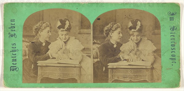 Mother and daughter looking at a book, leaning on a table; German; 1860s; Albumen silver print