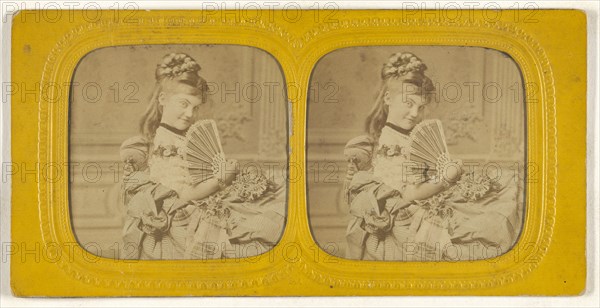 Woman seated on a divan holding a hand fan; E. Lamy, French, active 1860s - 1870s, 1860s; Hand-colored Albumen silver print