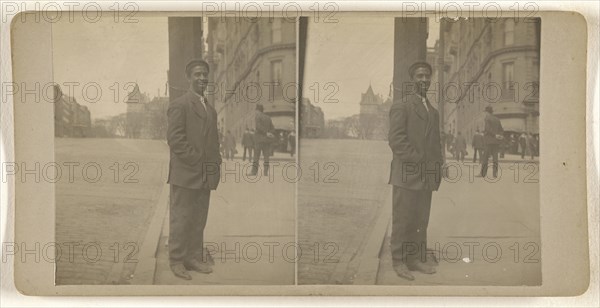 Black man posed on street at light pole, Albany, N.Y; Julius M. Wendt, American, active 1900s - 1910s, 1900s; Gelatin silver