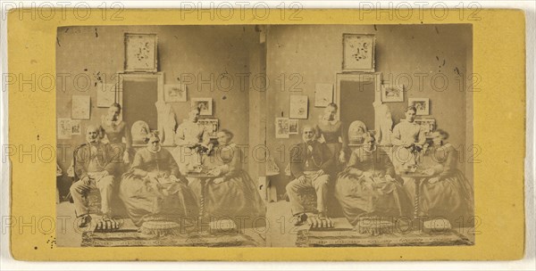 Family portrait, taken in living room, photographs and paintings on the wall behind; about 1865; Albumen silver print