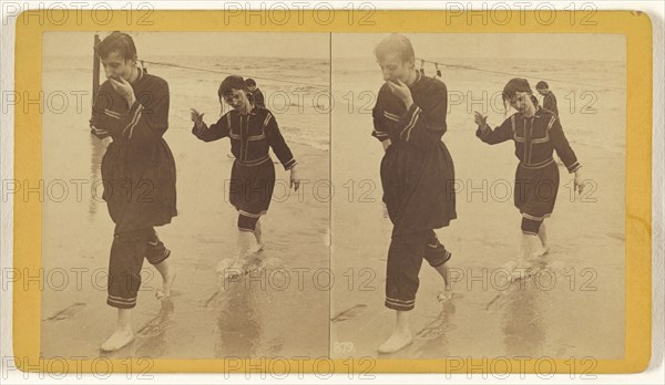 Man and woman dressed in similar costumes walking across beach; about 1865; Albumen silver print