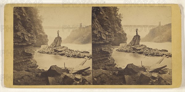 Man standing on rock in stream, bridge in background; British; about 1865; Albumen silver print