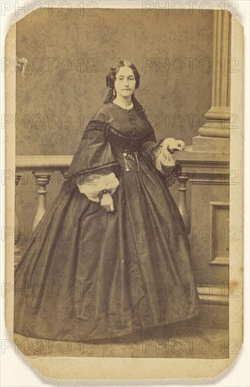 woman in long dress, standing; Edward S. Dunshee, American, active 1850s - 1890s, about 1870; Albumen silver print