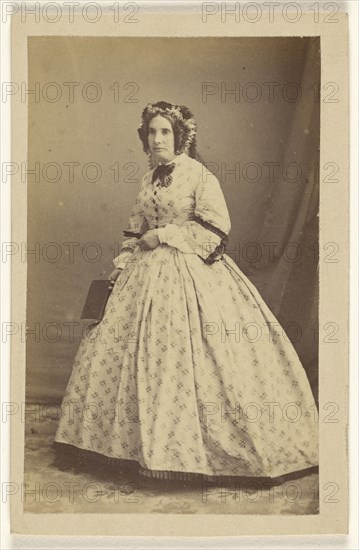 woman in white dress, standing; Bailly & Maurice; 1865 - 1870; Albumen silver print